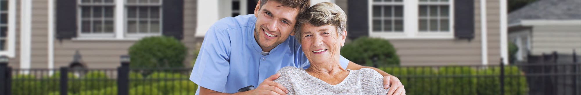 caregiver with senior woman smiling