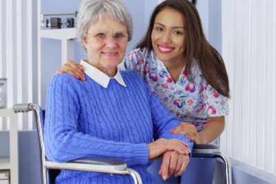 senior woman with caregiver smiling